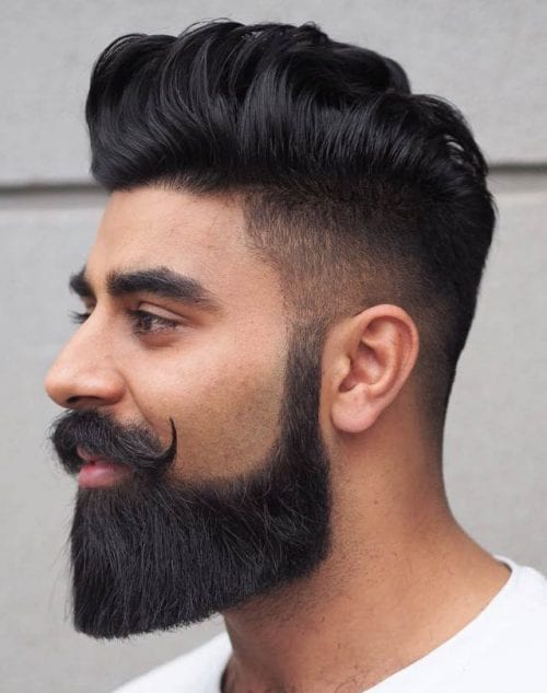 Pompadour z długą brodą Wysoki pompadour z długą brodą i podkręconymi wąsami